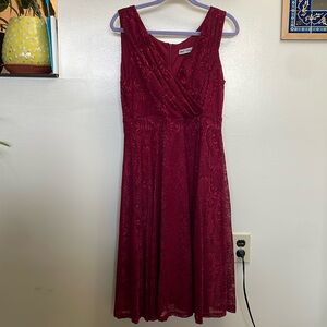 Dark red sleeveless lace dress.